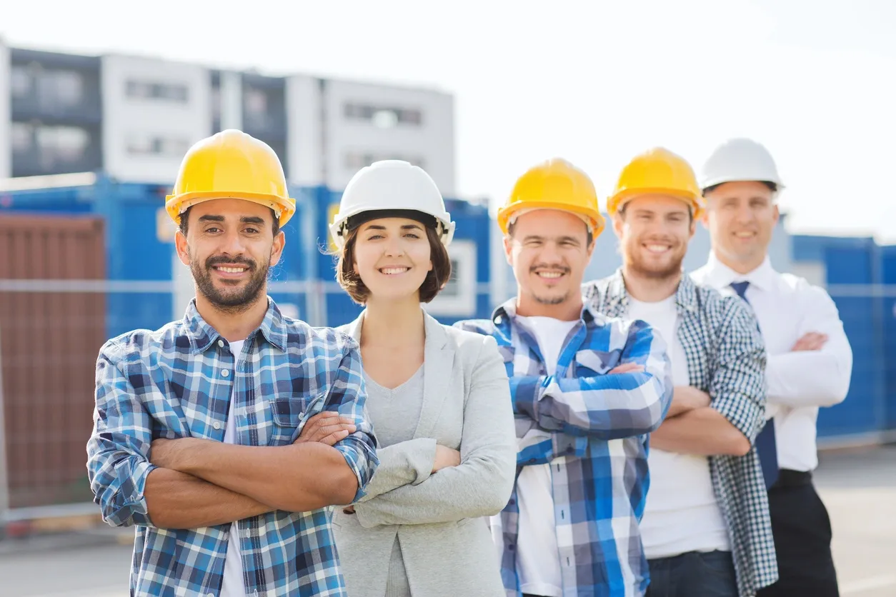 Construction workers and professionals at construction site